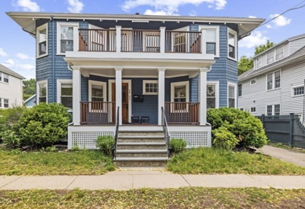 29 Worcester Street, Unit 1 Belmont, MA 02478 - Photo 1 of 27 a front view of a house with a yard
