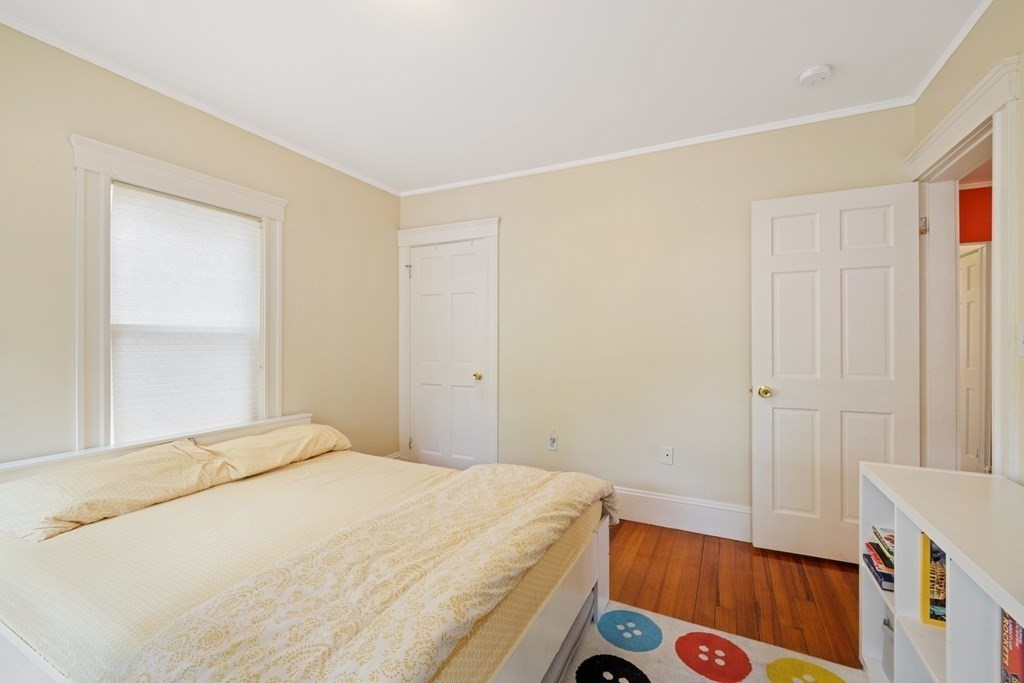 29 Worcester Street, Unit 1 Belmont, MA 02478 - Photo 20 of 27 a bedroom with a bed and a window