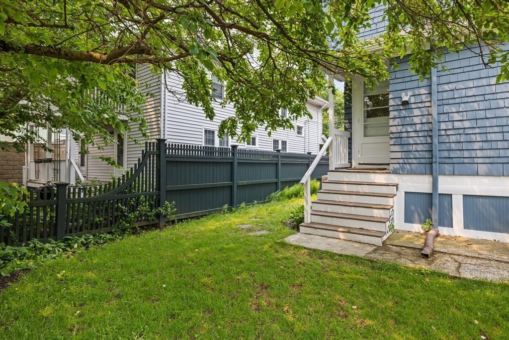 29 Worcester Street, Unit 1 Belmont, MA 02478 - Photo 25 of 27 a view of a house with a yard