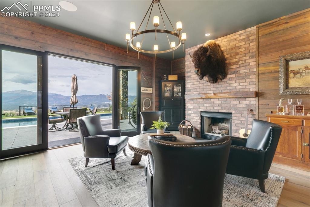 14040 Shadow Pines Road Colorado Springs, CO 80921 - Photo 18 of 50 a living room with fireplace furniture and a large window