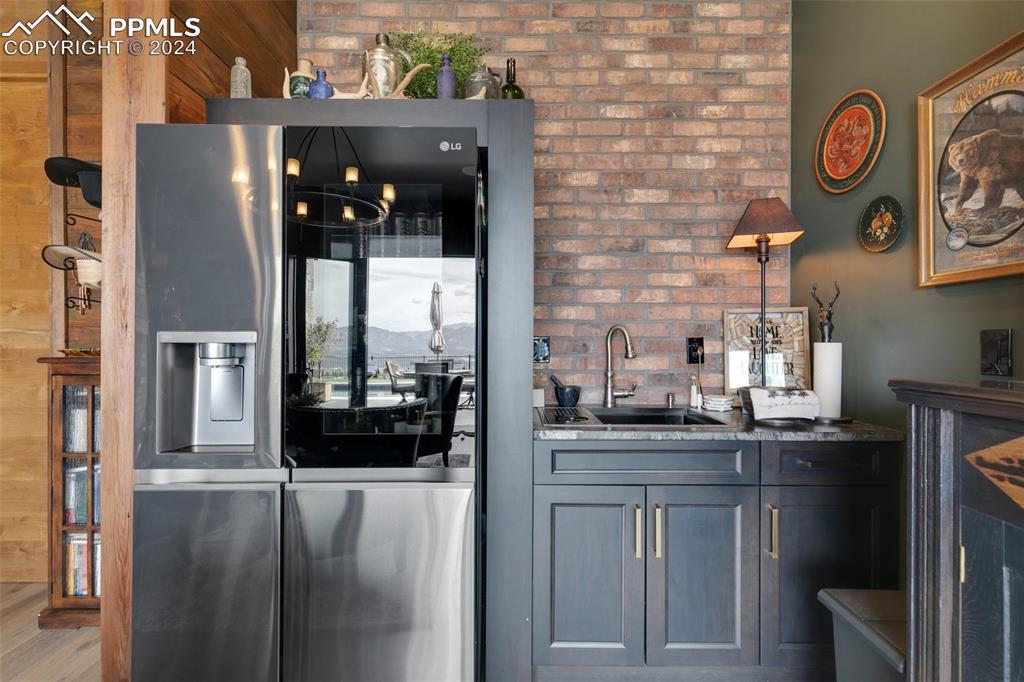 14040 Shadow Pines Road Colorado Springs, CO 80921 - Photo 19 of 50 a kitchen with a sink and cabinets
