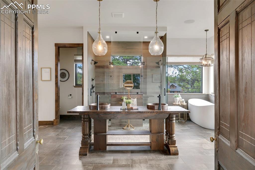 14040 Shadow Pines Road Colorado Springs, CO 80921 - Photo 24 of 50 a kitchen with a table and chairs