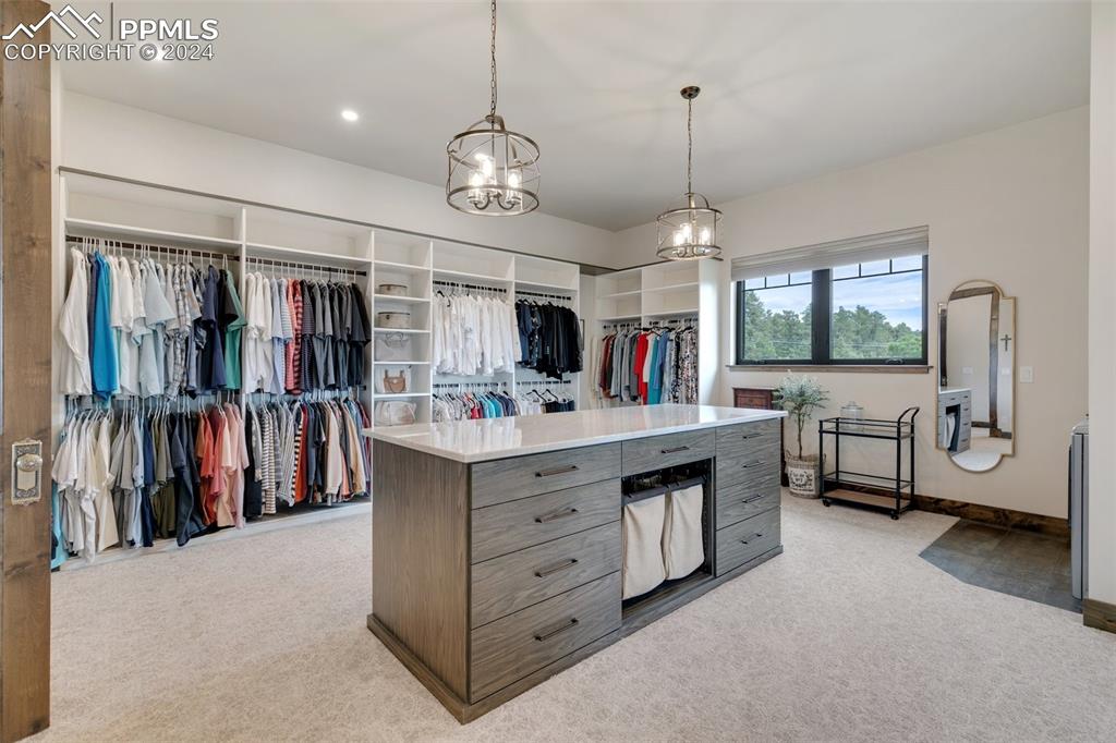 14040 Shadow Pines Road Colorado Springs, CO 80921 - Photo 29 of 50 a large kitchen with a large window and stainless steel appliances