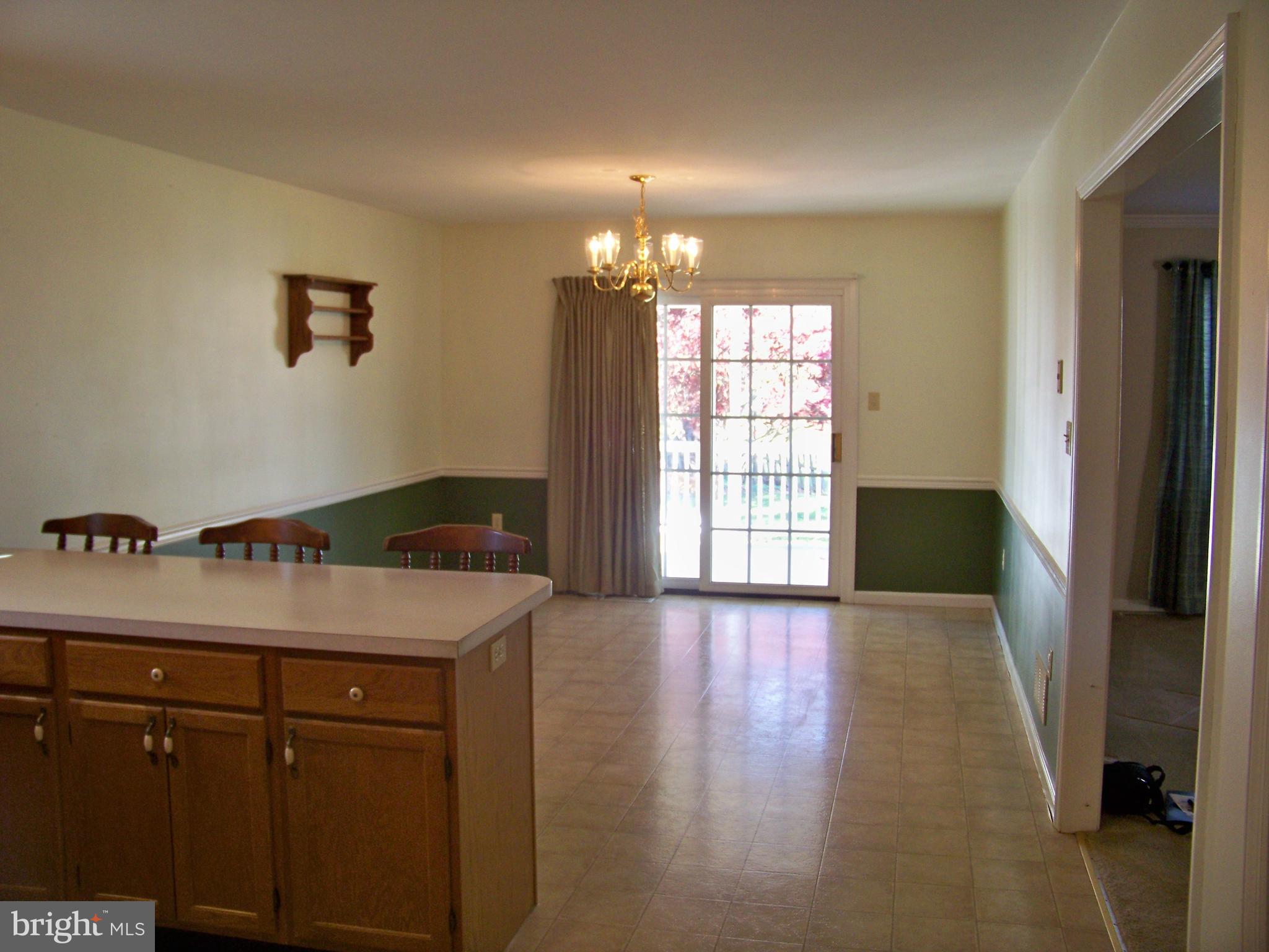 259 Raspberry Road Leola, PA 17540 - Photo 11 of 27 a kitchen with a wooden floor and window