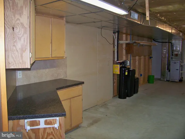 a room with gym equipment and a table