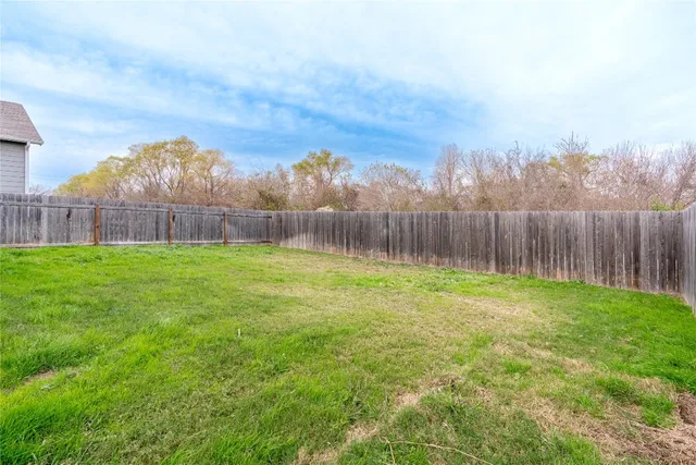 a view of a backyard with a garden