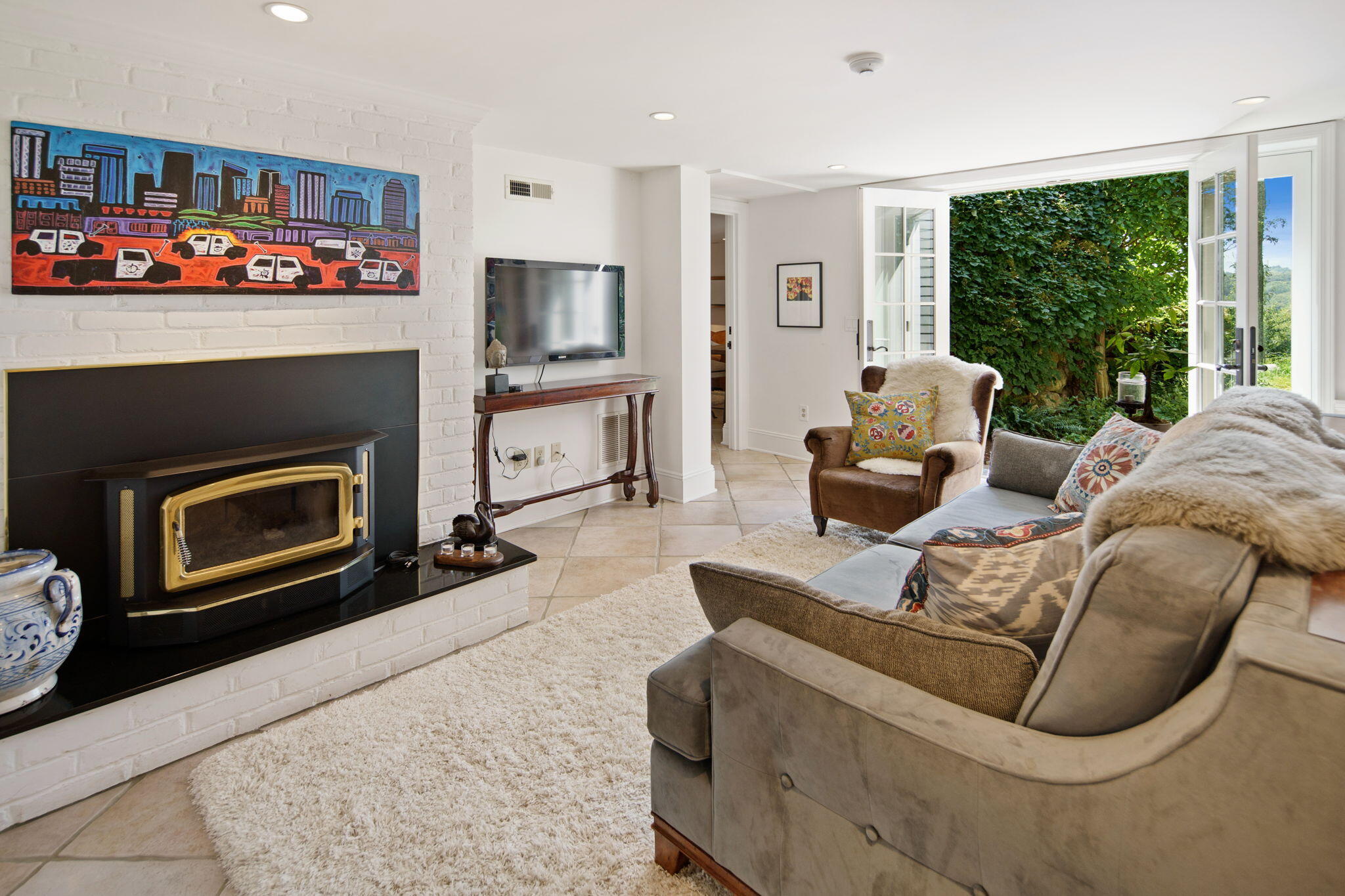 147 Fox Run Road New Canaan, CT 06840 - Photo 37 of 65 a living room with furniture a fireplace and a flat screen tv