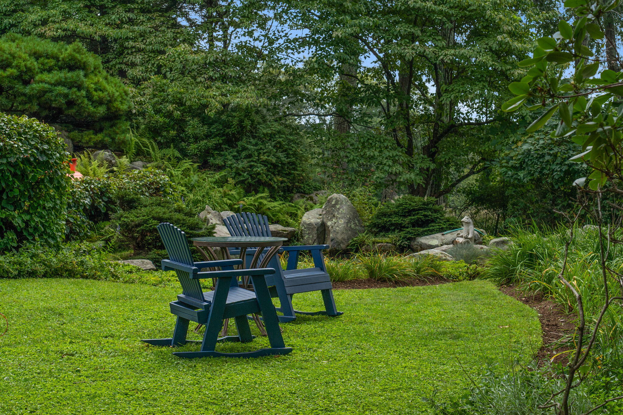 147 Fox Run Road New Canaan, CT 06840 - Photo 45 of 65 a view of a chairs and table in the garden