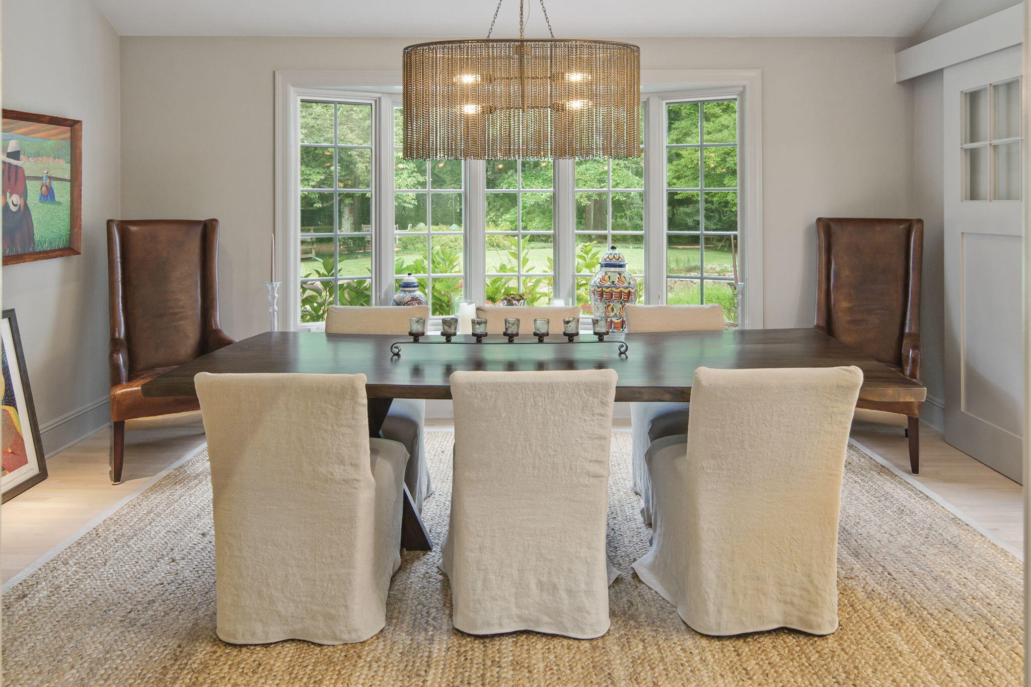 147 Fox Run Road New Canaan, CT 06840 - Photo 6 of 65 a dining room with furniture a large window and a flat screen tv