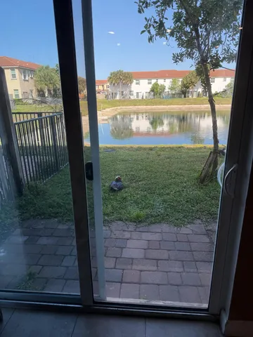 an aerial view of a house with lake view and a mountain view