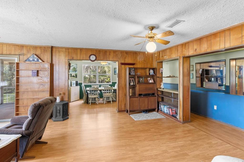 1226 South Telephone Point Road Inverness, FL 34450 - Photo 23 of 43 a view of a livingroom with furniture and a ceiling fan