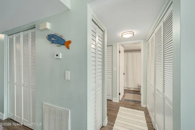 a view of a bathroom from a hallway