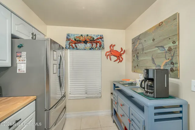 a kitchen with stainless steel appliances granite countertop a refrigerator and a stove