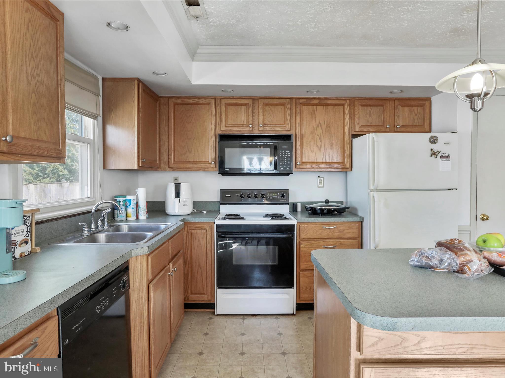239 Chestnut Street Winchester, VA 22601 - Photo 13 of 35 a kitchen with a sink stove and refrigerator