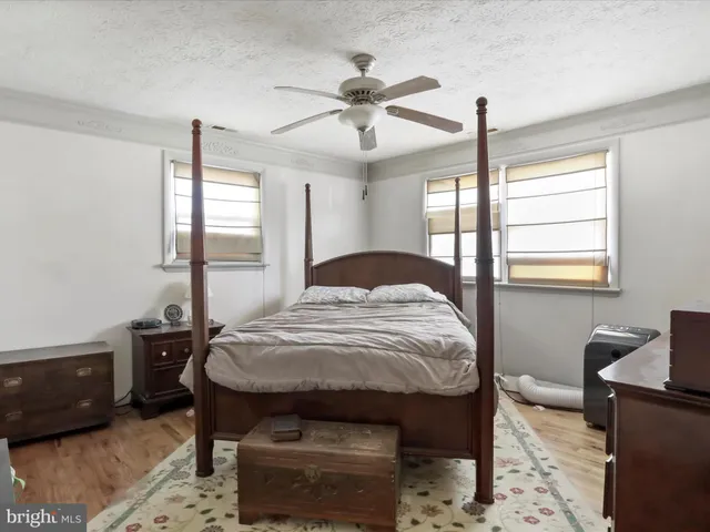 a bedroom with a bed and a table