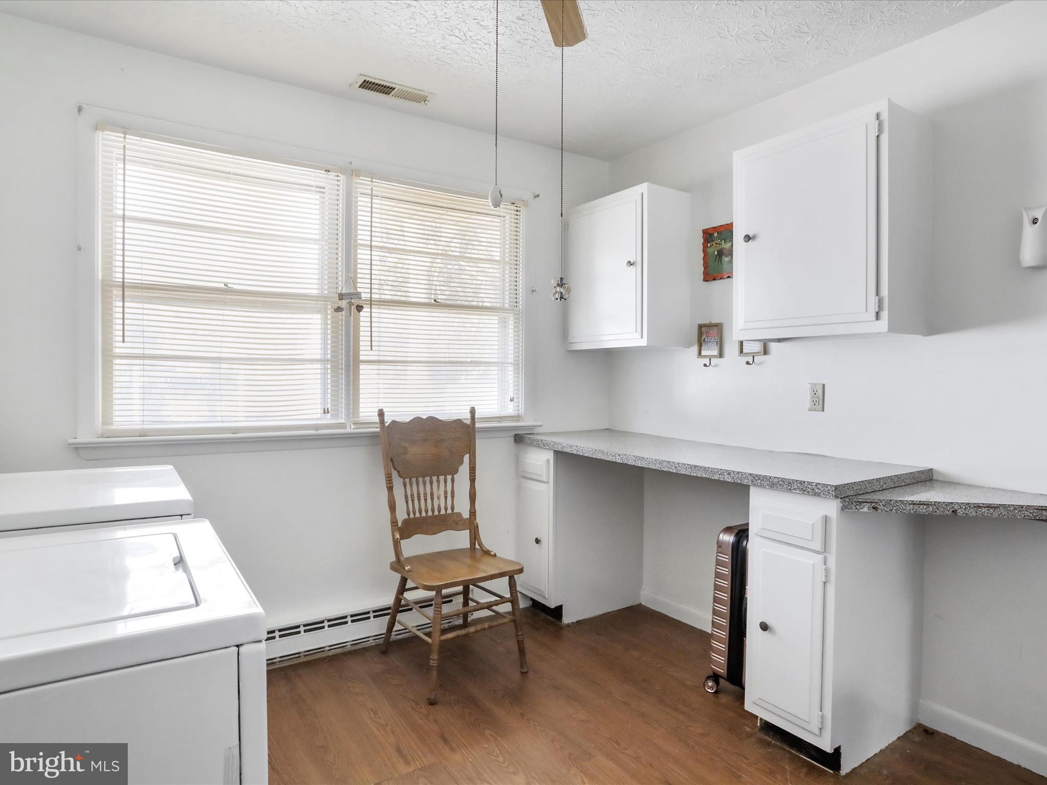 239 Chestnut Street Winchester, VA 22601 - Photo 22 of 35 a room with a window and chairs