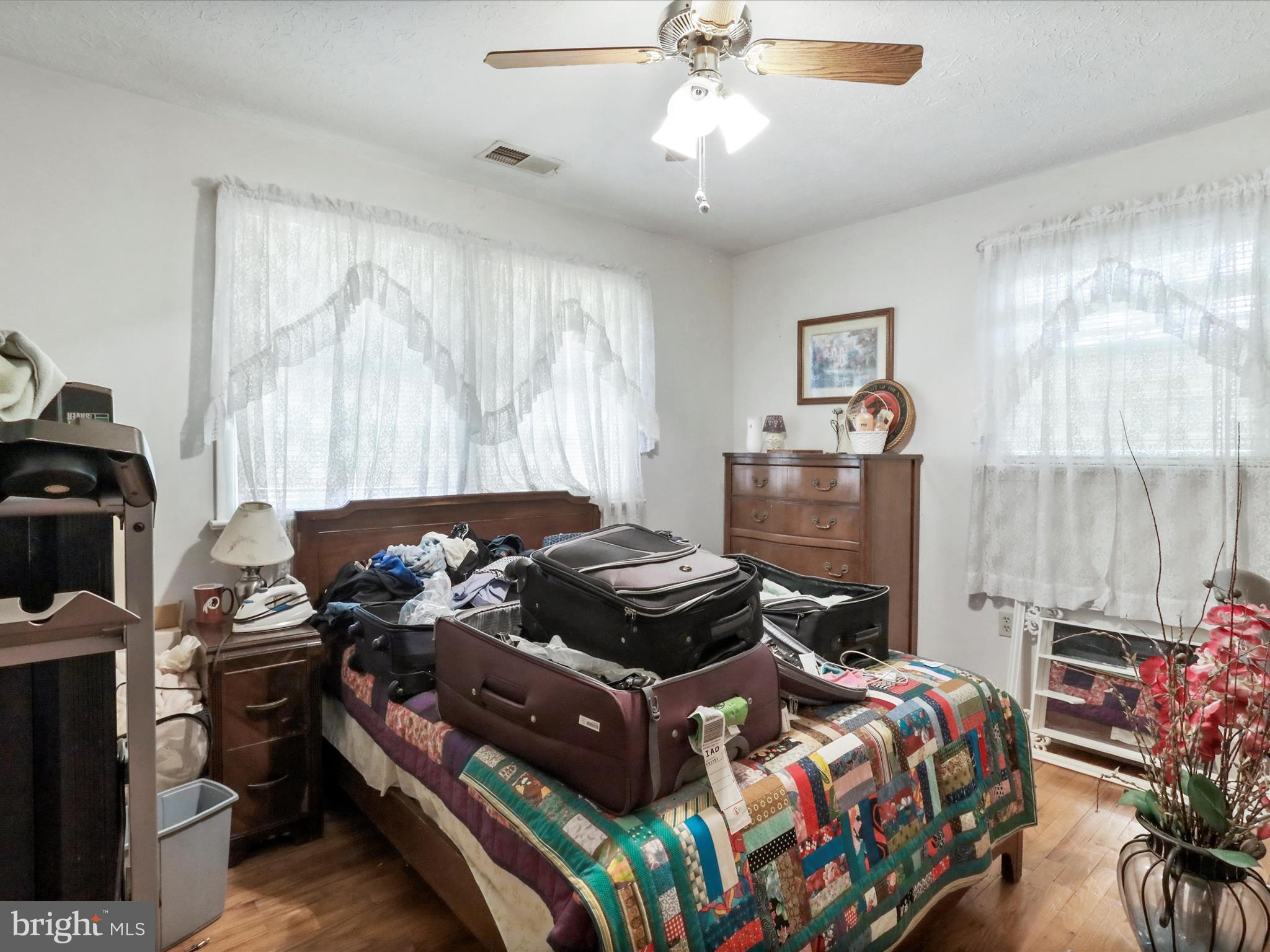 239 Chestnut Street Winchester, VA 22601 - Photo 24 of 35 a bedroom with a bed and a chandelier