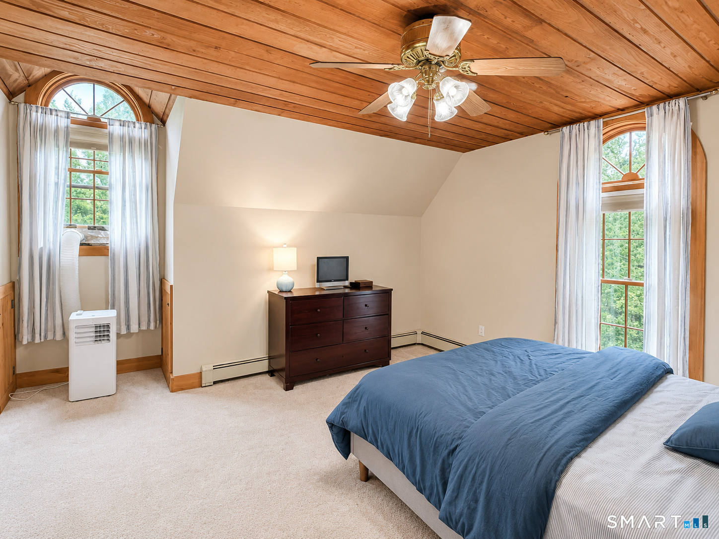 44 Pine Road Colebrook, CT 06021 - Photo 23 of 40 a bedroom with a bed and a chandelier