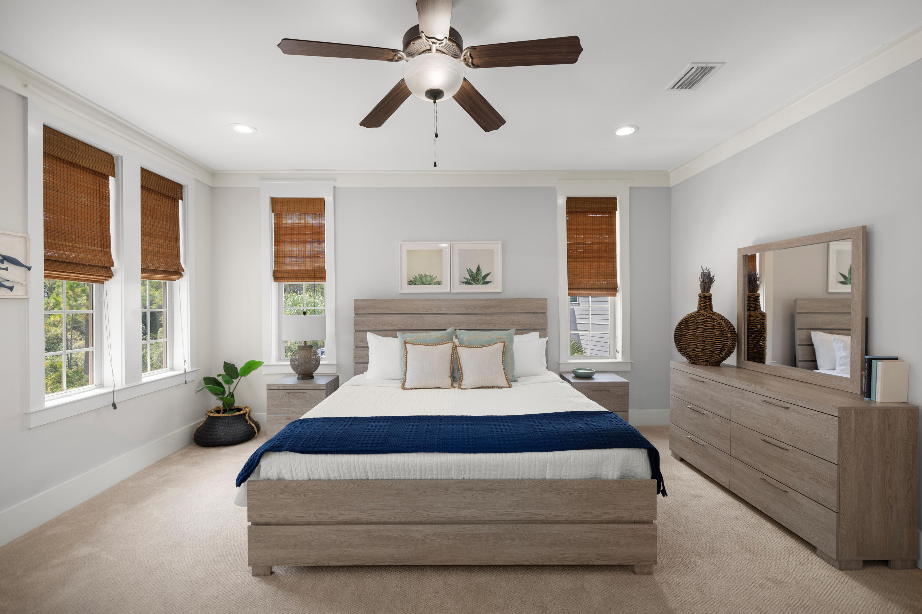 402 Redbud Lane Inlet Beach, FL 32461 - Photo 14 of 44 a bedroom with a large bed and a chandelier