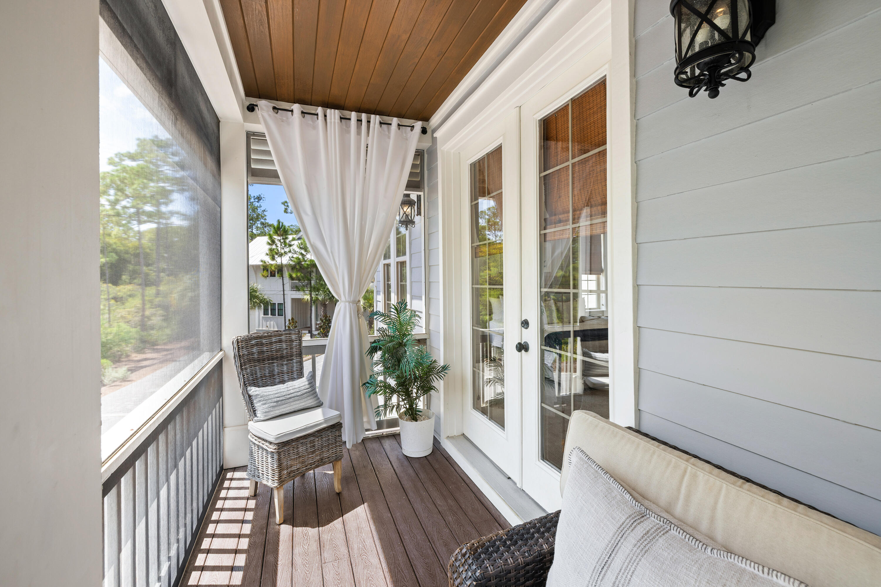 402 Redbud Lane Inlet Beach, FL 32461 - Photo 16 of 44 a view of a balcony with wooden floor and furniture