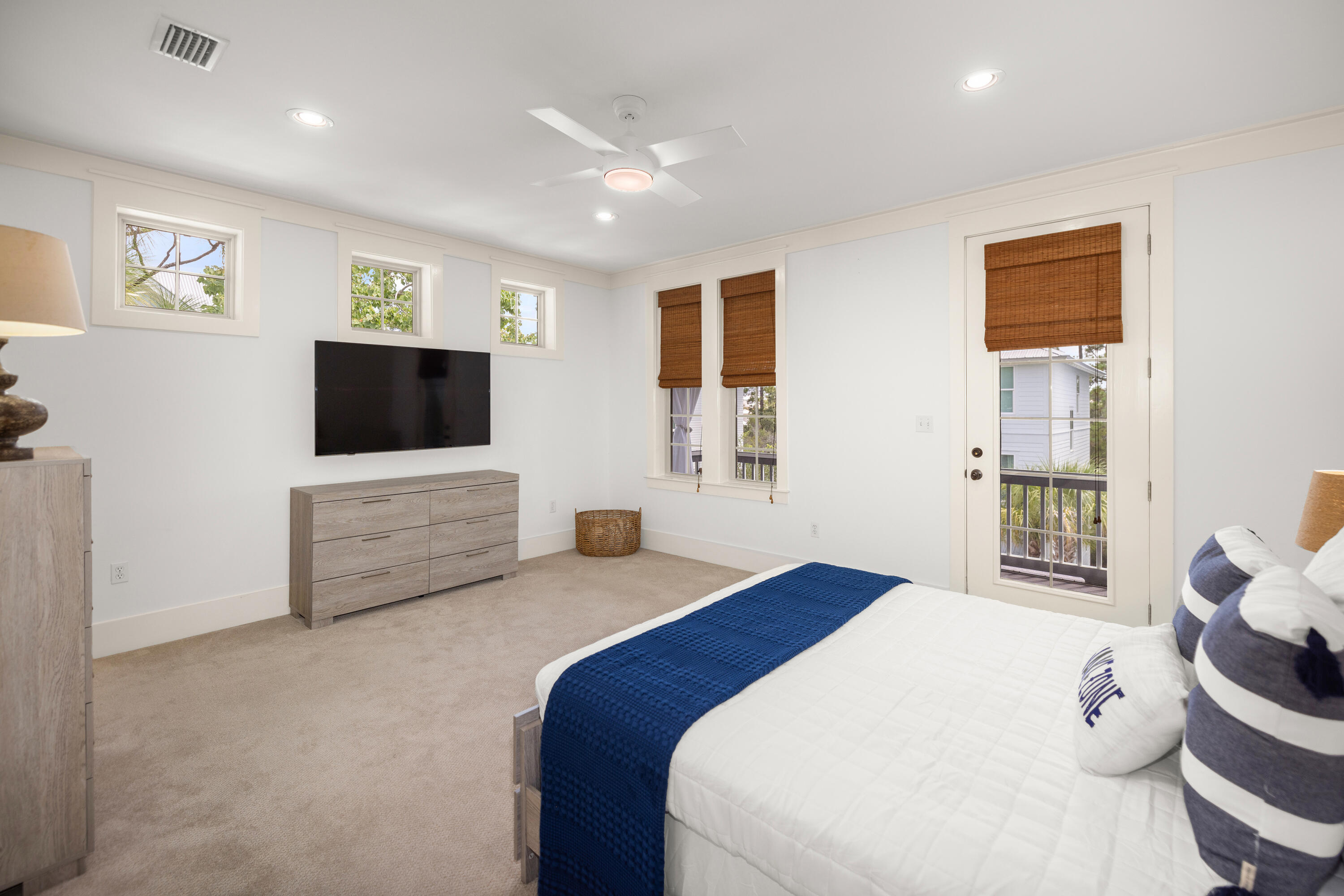 402 Redbud Lane Inlet Beach, FL 32461 - Photo 25 of 44 a bedroom with a bed and a flat tv screen on dresser