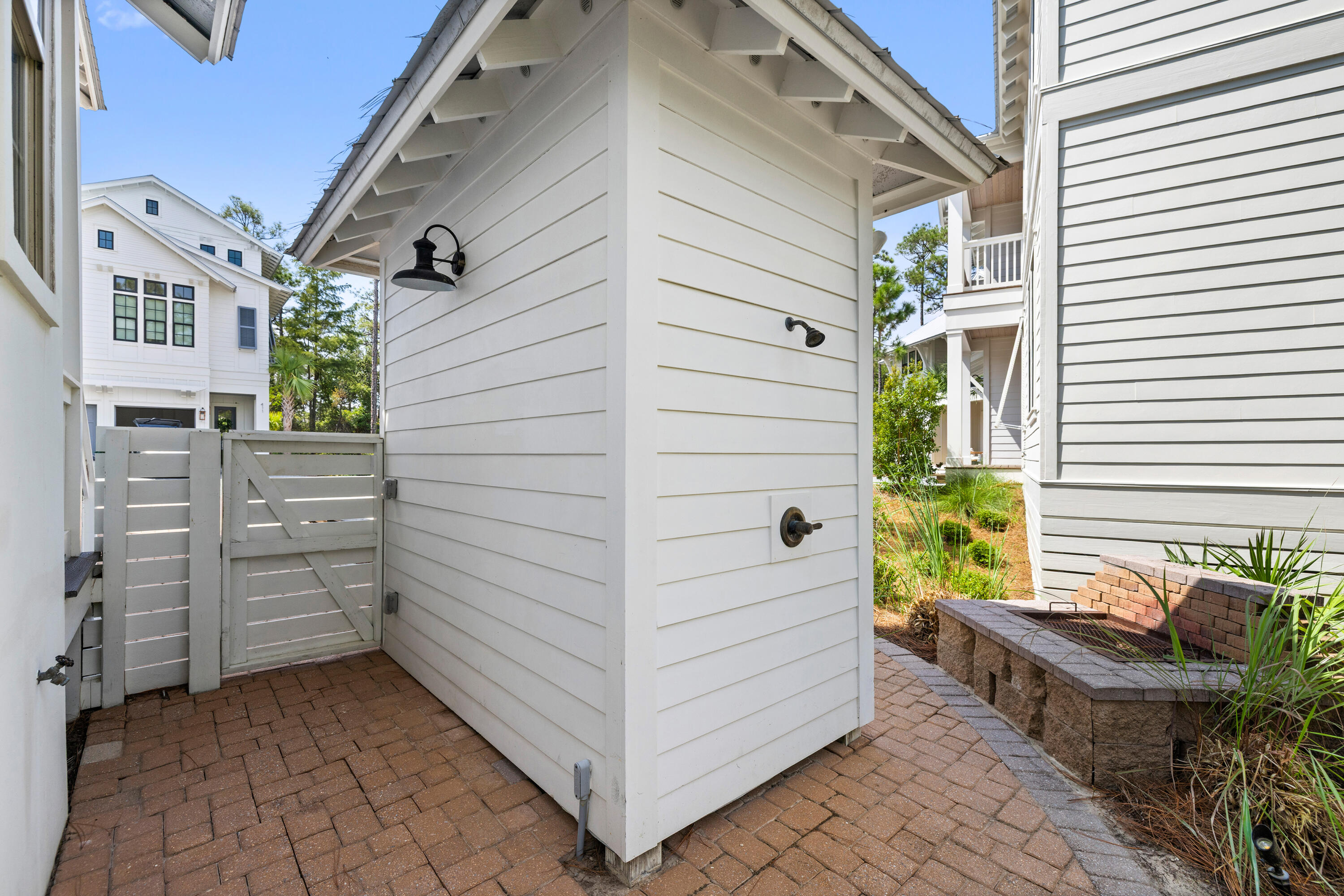 402 Redbud Lane Inlet Beach, FL 32461 - Photo 33 of 44 a view of a porch with wooden chairs