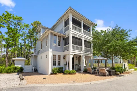 a view of a backyard with white door and outdoor space