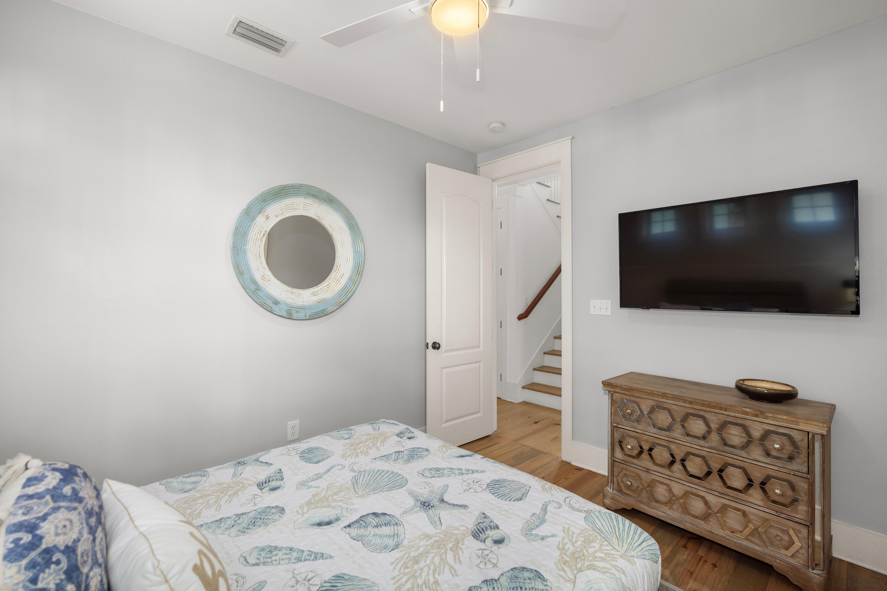 402 Redbud Lane Inlet Beach, FL 32461 - Photo 9 of 44 a bedroom with a bed and a flat screen tv