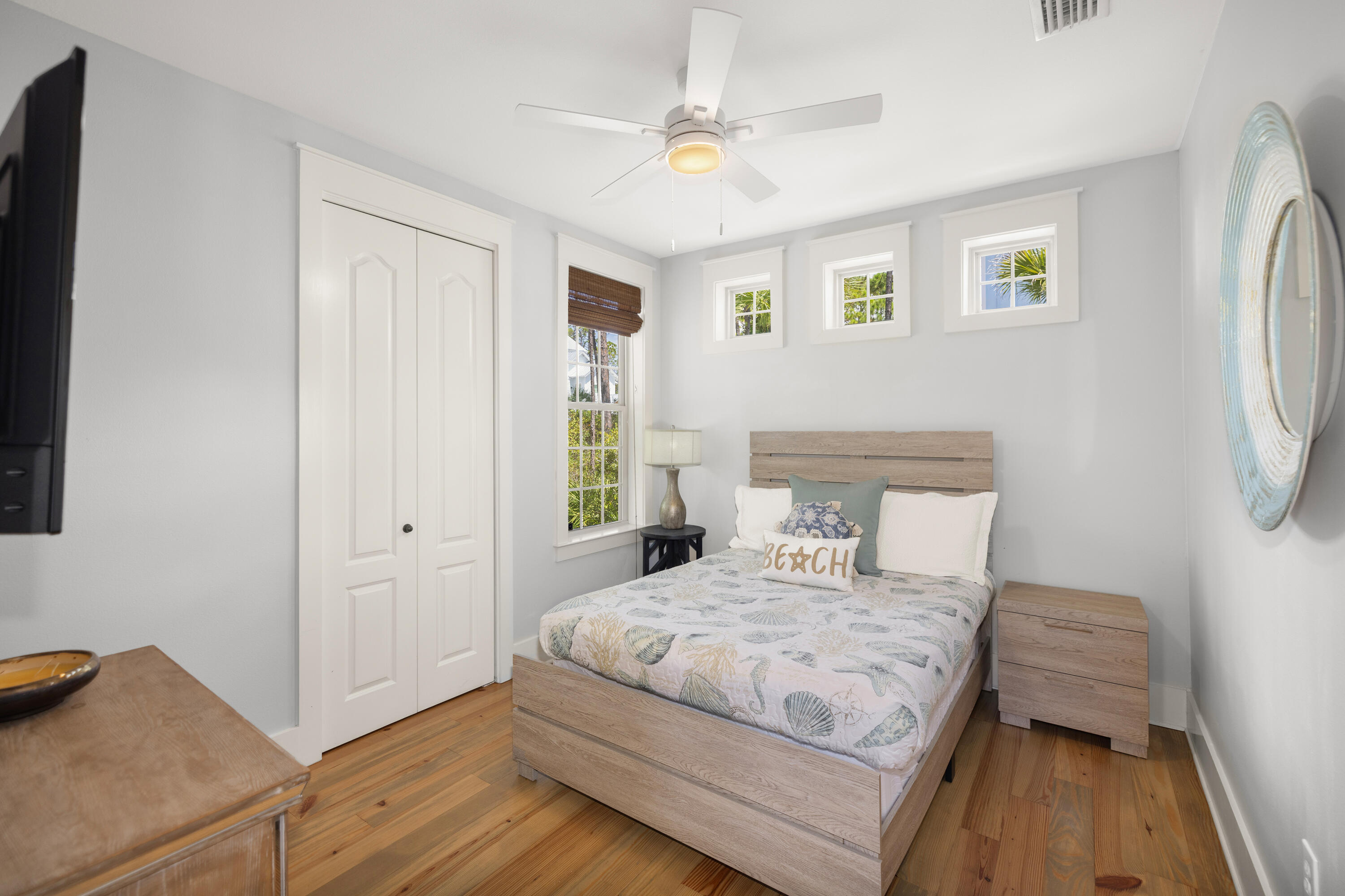 402 Redbud Lane Inlet Beach, FL 32461 - Photo 10 of 44 a bedroom with a bed and a chandelier