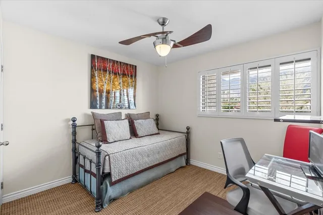 a bed room with a bed and a window