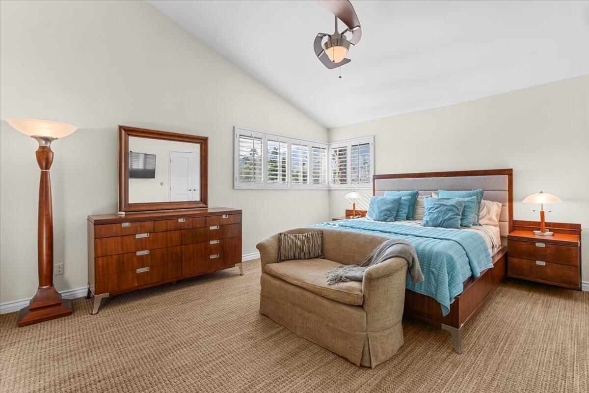 3155 Ramon Road, Unit 312 Palm Springs, CA 92264 - Photo 17 of 34 a bedroom with a bed and a couch