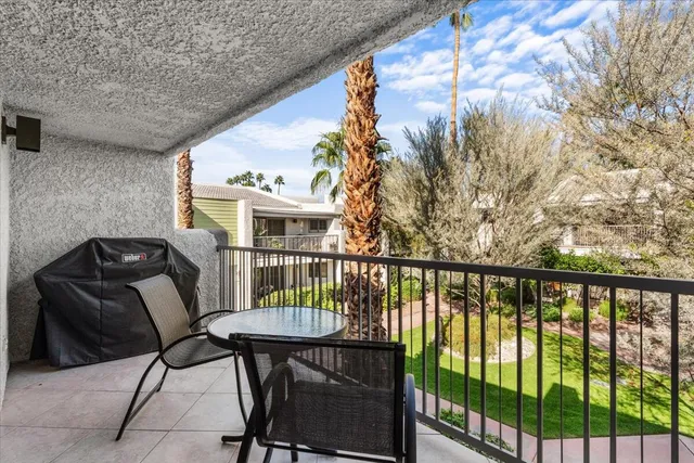 a view of a balcony with chairs
