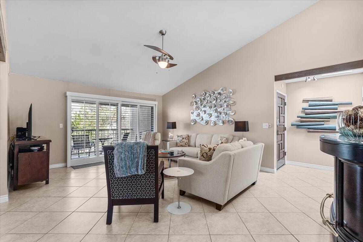 3155 Ramon Road, Unit 312 Palm Springs, CA 92264 - Photo 6 of 34 a living room with furniture and a large window