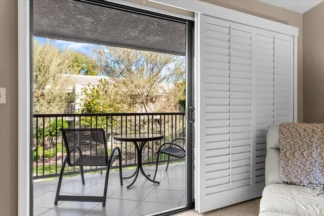 a view of a room with furniture and a window