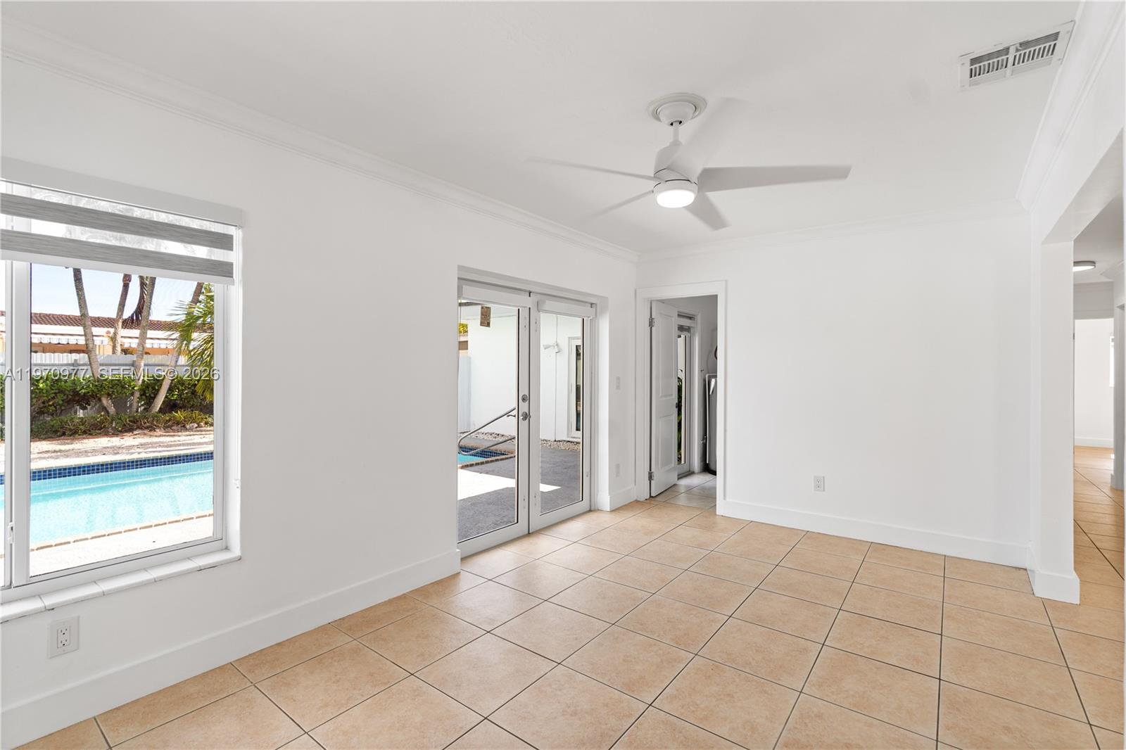 5103 Southwest 128th Place Miami, FL 33175 - Photo 15 of 38 wooden floor in an empty room with a window