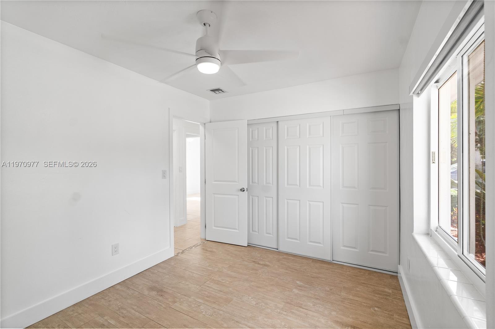 5103 Southwest 128th Place Miami, FL 33175 - Photo 18 of 38 a view of an empty room with a window