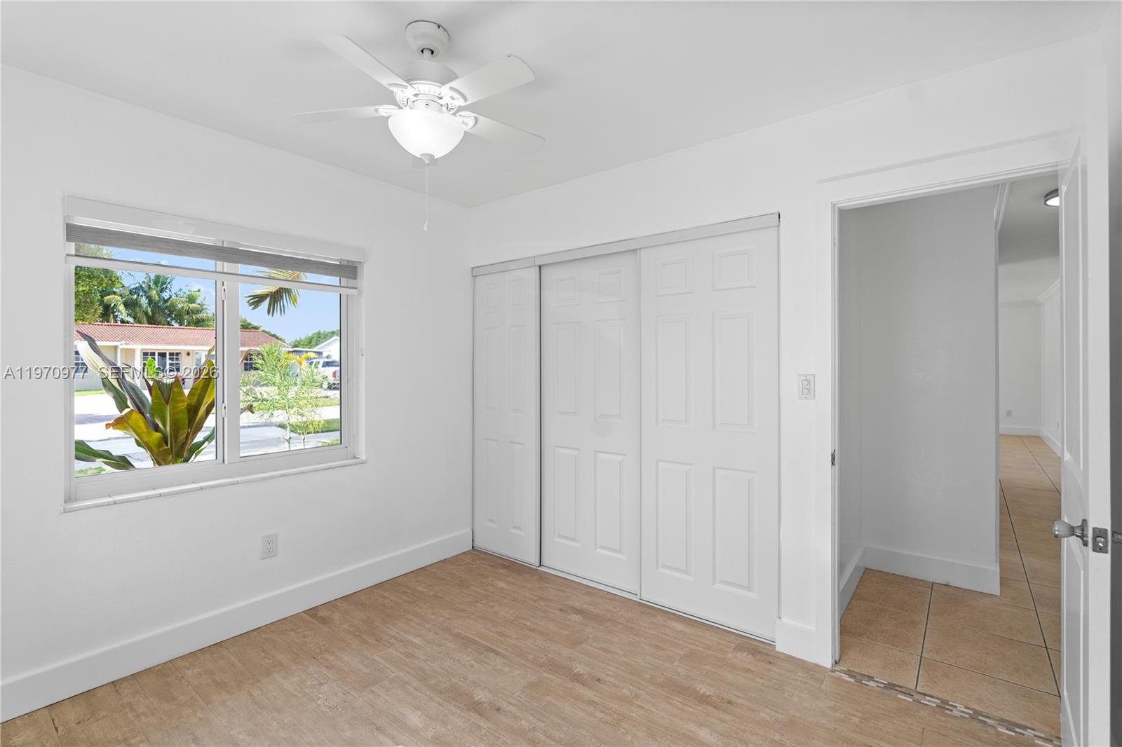 5103 Southwest 128th Place Miami, FL 33175 - Photo 22 of 38 a view of an empty room with window and closet area