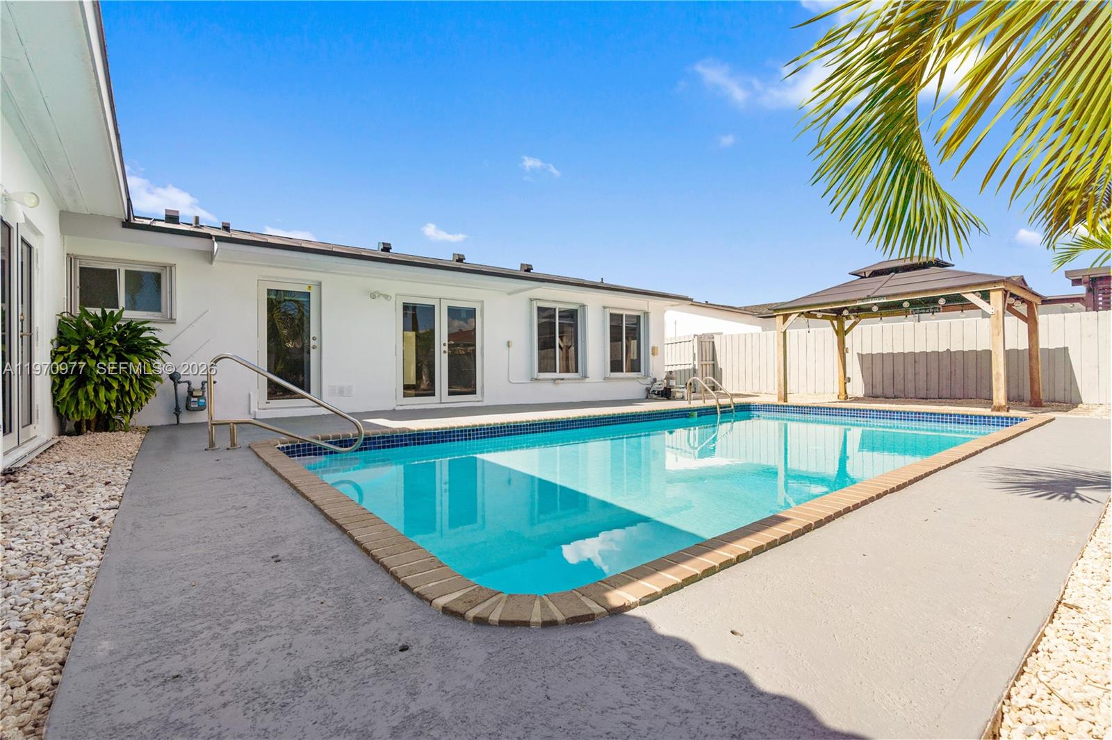 5103 Southwest 128th Place Miami, FL 33175 - Photo 35 of 38 a view of a house with swimming pool