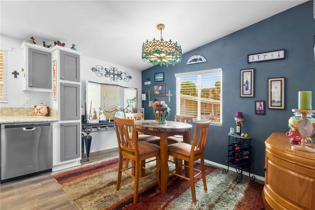 3700 Buchanan Street, Unit 108 Riverside, CA 92503 - Photo 11 of 31 a view of a dining room with furniture window and wooden floor