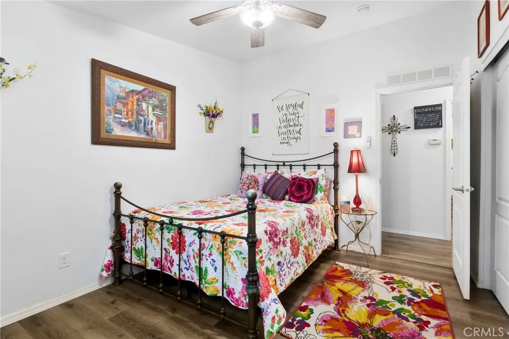3700 Buchanan Street, Unit 108 Riverside, CA 92503 - Photo 13 of 31 a bedroom with bed and paintings on the wall