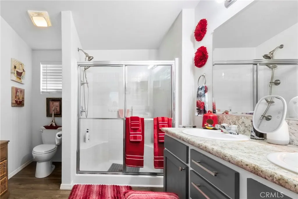 3700 Buchanan Street, Unit 108 Riverside, CA 92503 - Photo 17 of 31 a bathroom with a granite countertop toilet sink and shower