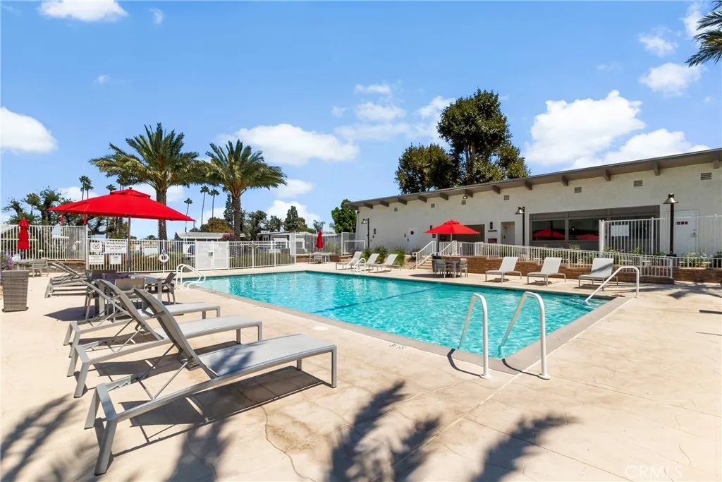 3700 Buchanan Street, Unit 108 Riverside, CA 92503 - Photo 29 of 31 a view of a swimming pool with a table and chairs