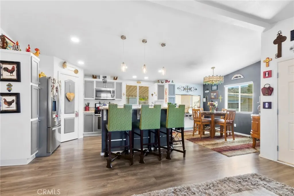 3700 Buchanan Street, Unit 108 Riverside, CA 92503 - Photo 8 of 31 a view of a dining room with furniture and wooden floor