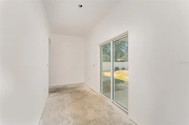 an empty room with glass windows