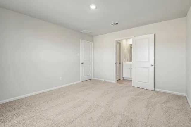 a kitchen with stainless steel appliances granite countertop a refrigerator stove and sink