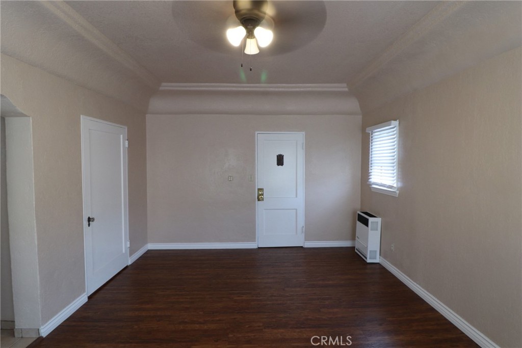 925 North Lacy Street, Unit 4 Santa Ana, CA 92701 - Photo 4 of 20 a view of a room with wooden floor and staircase