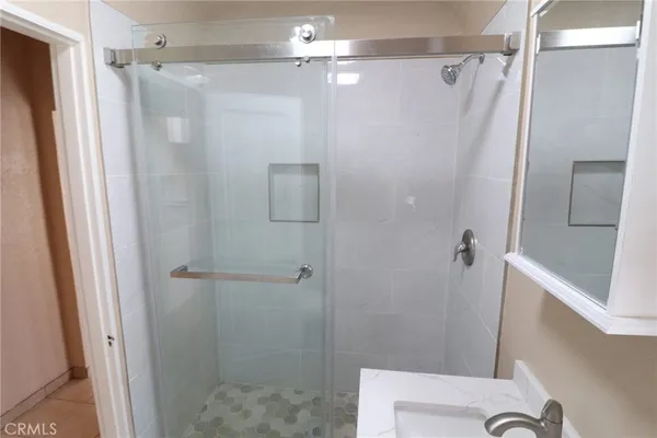 a bathroom with a shower and a toilet