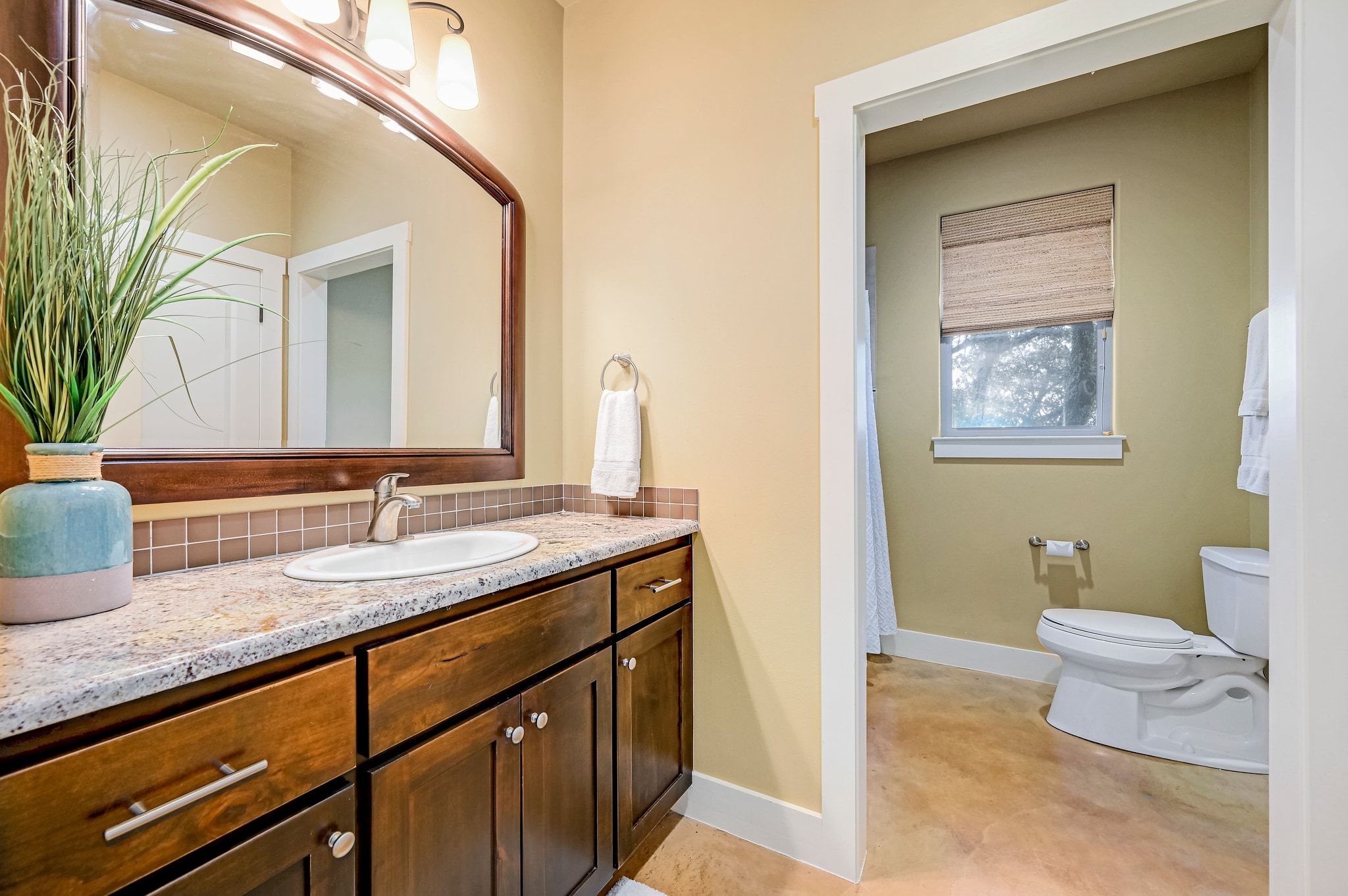 2551 Wolf Creek Ranch Road Burnet, TX 78611 - Photo 13 of 40 Full bath featuring vanity, curtained shower, and backsplash