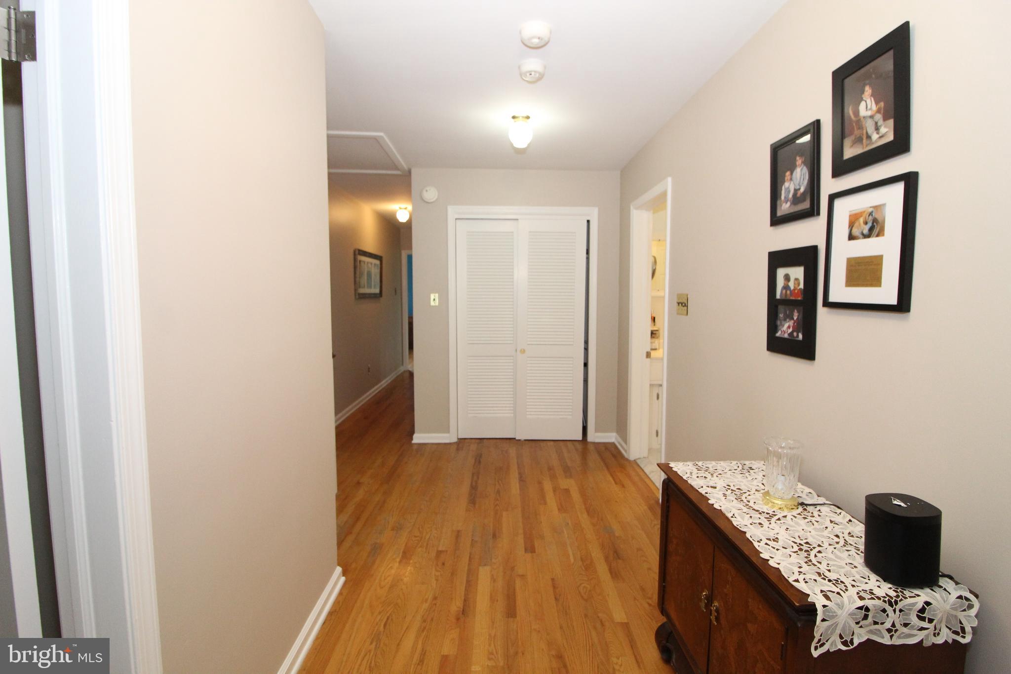 729 Halstead Road Wilmington, DE 19803 - Photo 13 of 25 Inviting hallway with warm wooden floors.