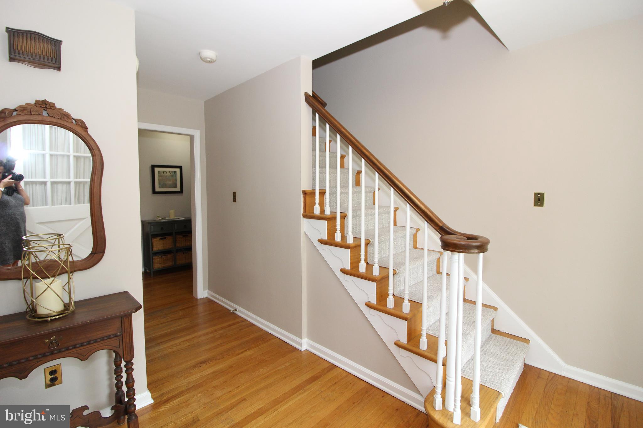 Inviting entryway with elegant staircase.